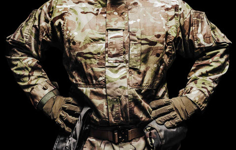 A soldier in a multicamouflaged tunic and tactical belt