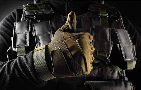 Soldier showing thumbs up gesture in tactical gloves, close-up front view, demonstrating high-quality tactical vest.