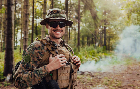 Man in Protective Army Tactical Gear Taking a Break and Relaxing.