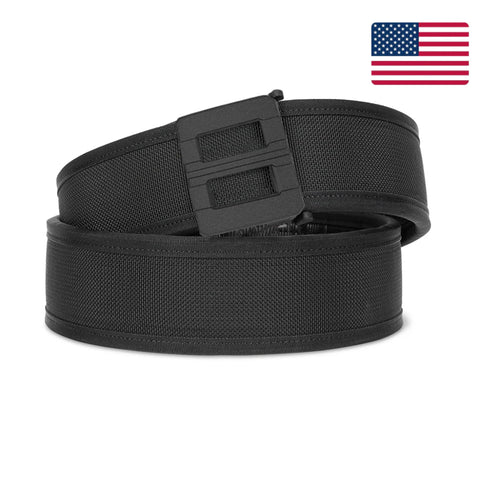 Black belt with a plastic buckle on a white background with an American flag.