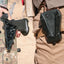 Person holding a bow with a black quiver labeled 'Kore' on a desert background
